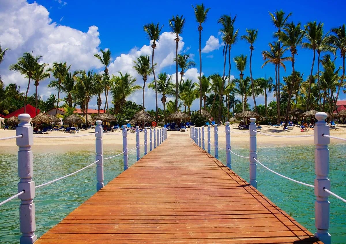 A wooden jetty leading into turquoise water