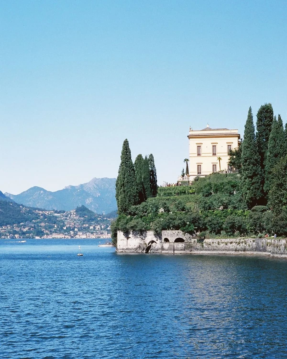 A villa among cypresses on the shore of Lake Como