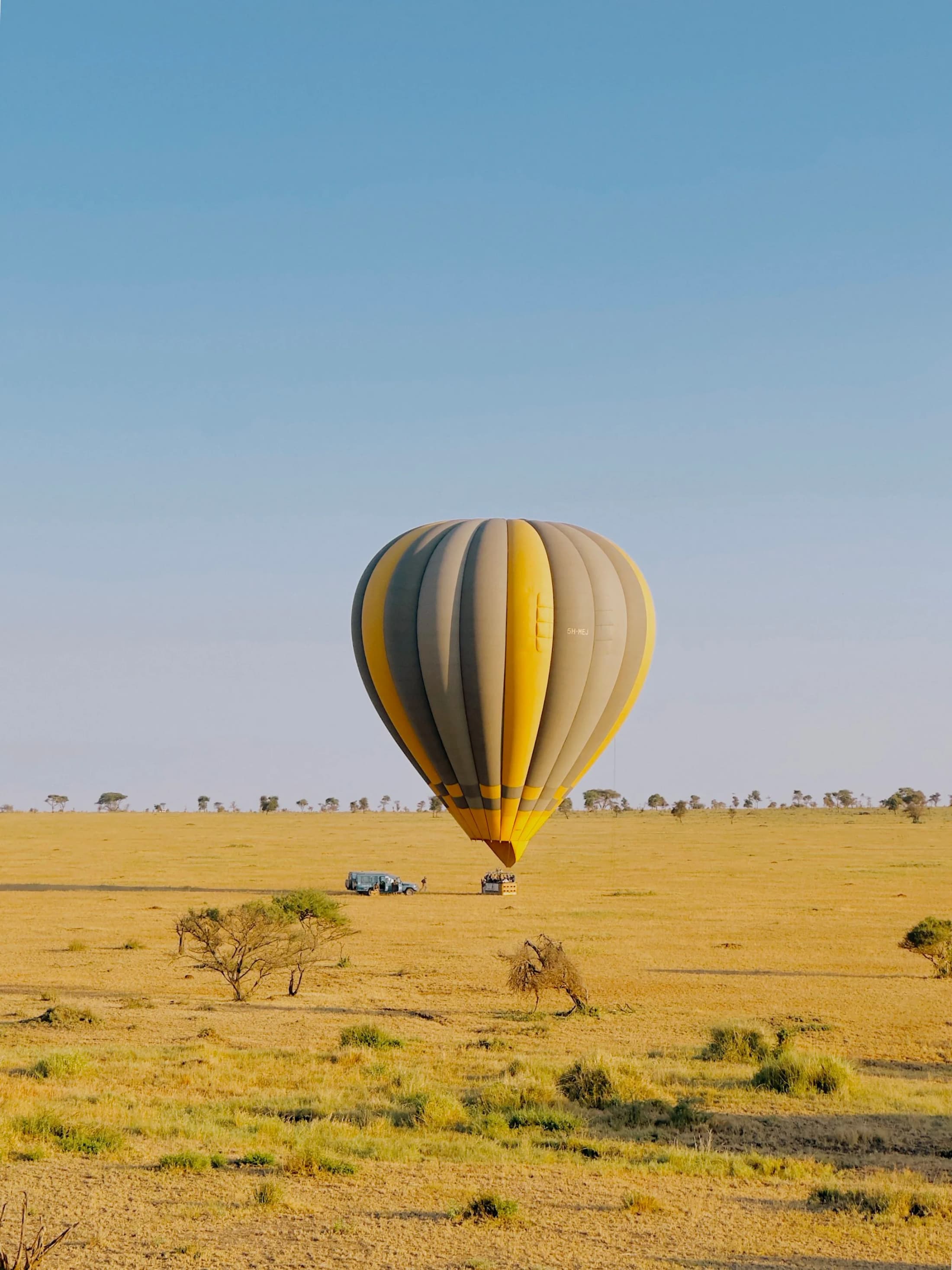 A hot-air balloon drifting over the Serengeti plains